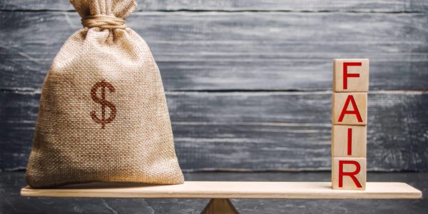Money,Bag,And,Wooden,Blocks,With,The,Word,Fair.,Balance. Money,Bag,And,Wooden,Blocks,With,The,Word,Fair.,Balance.
